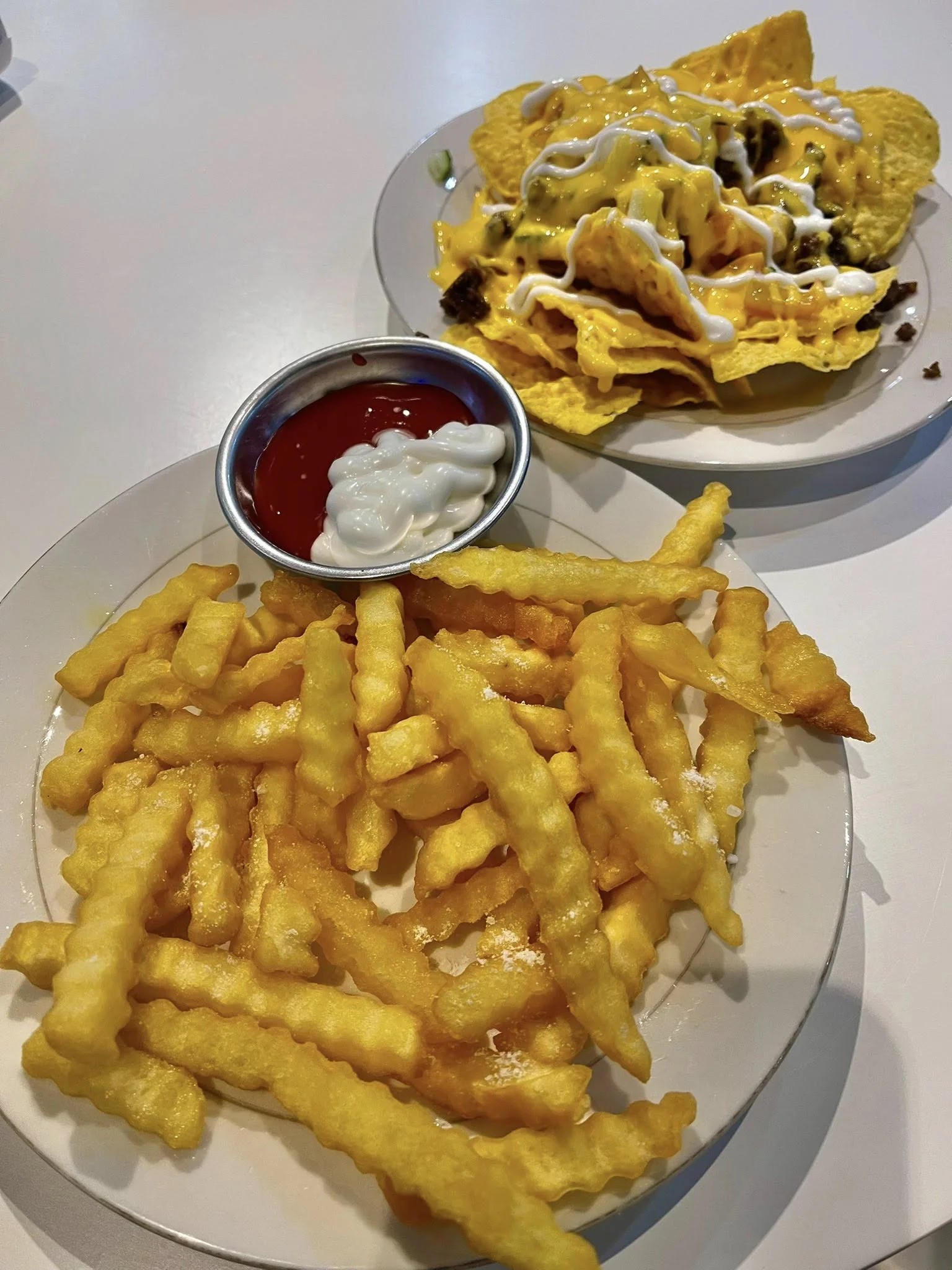 Fries and nachos at Amzng Café