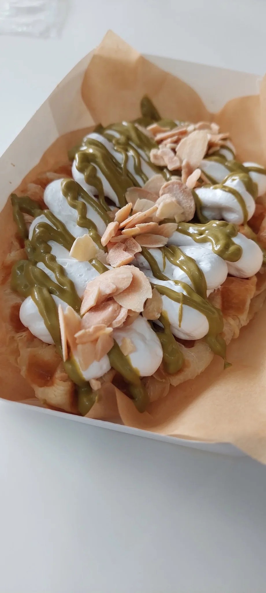 Waffle with cream and matcha topping at Amzng Café