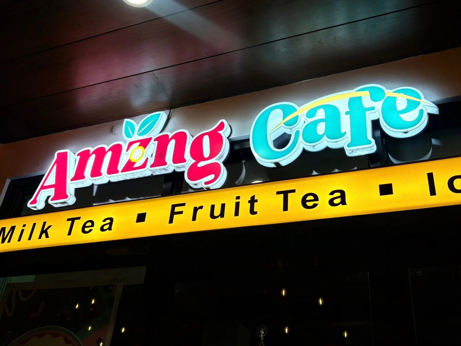 Amzng Café illuminated storefront sign